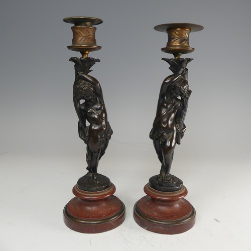 375 - A pair of French probably 19th century gilt and bronze figural Candlesticks, each featuring a maiden... 