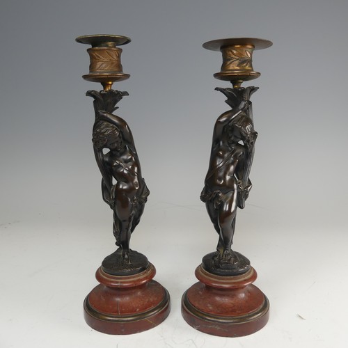 375 - A pair of French probably 19th century gilt and bronze figural Candlesticks, each featuring a maiden... 