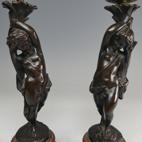 375 - A pair of French probably 19th century gilt and bronze figural Candlesticks, each featuring a maiden... 