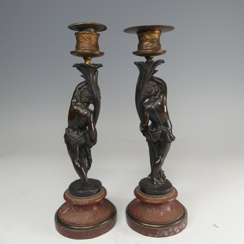 375 - A pair of French probably 19th century gilt and bronze figural Candlesticks, each featuring a maiden... 