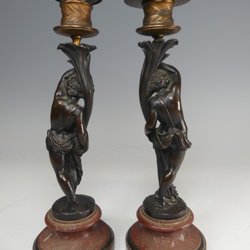 375 - A pair of French probably 19th century gilt and bronze figural Candlesticks, each featuring a maiden... 