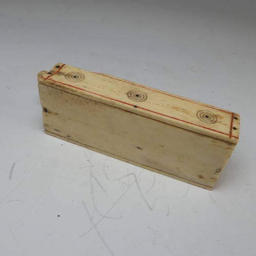 177 - An early 19th century French Prisoner of War carved bone Games Box, the sliding cover pierced for cr... 