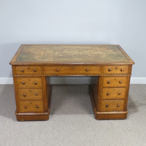 A good late 19th century oak twin pedestal Desk, rectangular top inset with gilt tooled leather skiver, above central frieze drawer over kneehole, flanked by four drawers to either side, locks stamped 'Hobbs & co, London', note damage to one of the handles, see images, W 137 cm x H 75 cm x D 75 cm.