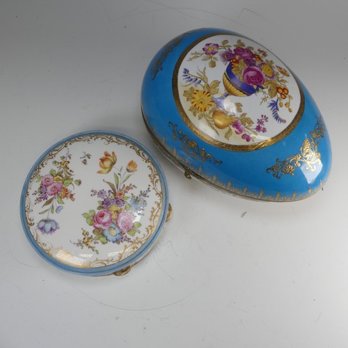 374 - A continental porcelain Sevres style egg shaped Box, blue ground with gilt metal mount, decorated wi... 