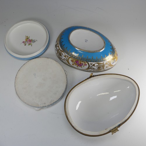 374 - A continental porcelain Sevres style egg shaped Box, blue ground with gilt metal mount, decorated wi... 