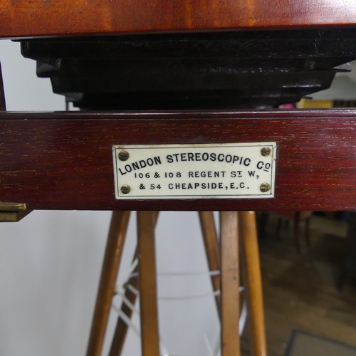 178 - A London Stereoscopic Co. Folding Studio Plate Camera, mahogany and brass with leather bellows and a... 