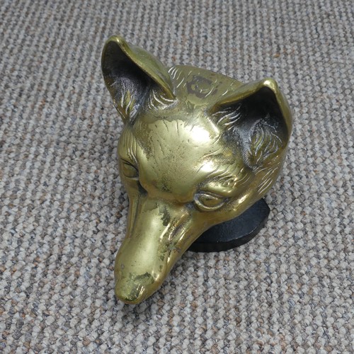 426 - An antique brass doorstop in the form of a Fox / Wolf, H 18 cm.