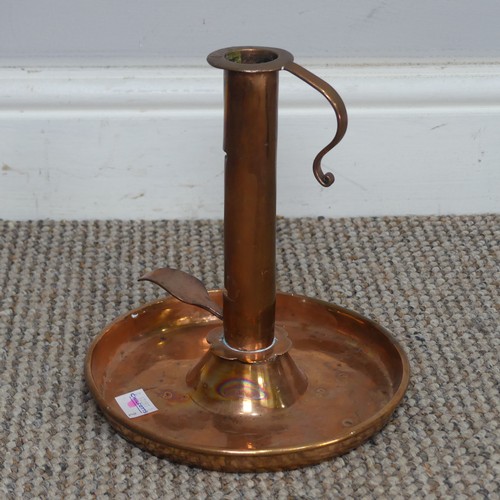 529 - An antique copper Chamber Stick, H 19.5 cm.