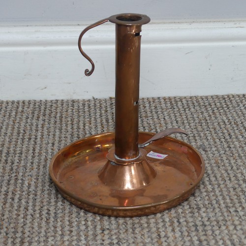 529 - An antique copper Chamber Stick, H 19.5 cm.