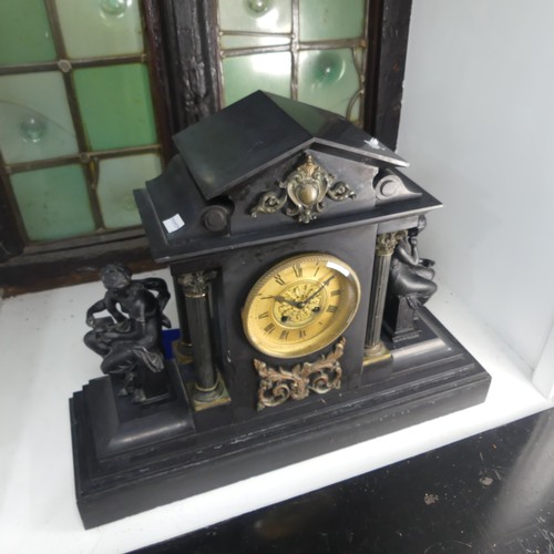 383 - A large Victorian slate mantle Clock by Howell & James Ltd, with metal garnitures to either side... 