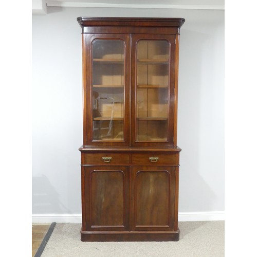 484 - A Victorian mahogany glazed Bookcase, moulded cornice over glazed doors and three adjustable shelves... 