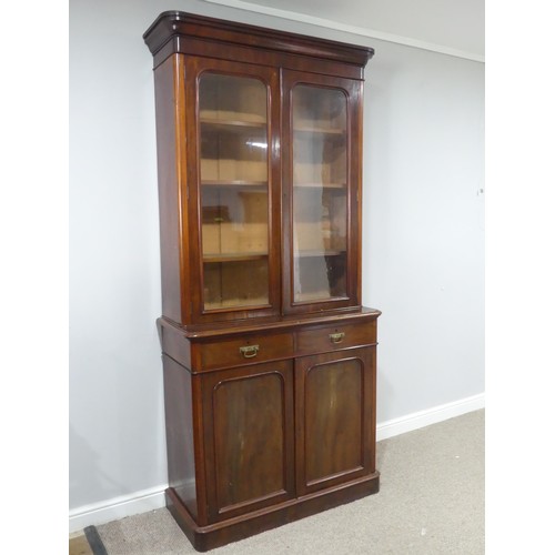 484 - A Victorian mahogany glazed Bookcase, moulded cornice over glazed doors and three adjustable shelves... 