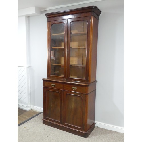 484 - A Victorian mahogany glazed Bookcase, moulded cornice over glazed doors and three adjustable shelves... 