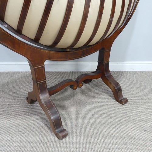 428 - An unusual Regency mahogany swing Cradle / Crib, circa 1820, of navette form with slatted sides and ... 