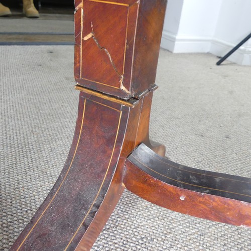 428 - An unusual Regency mahogany swing Cradle / Crib, circa 1820, of navette form with slatted sides and ... 