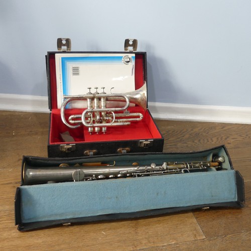 299 - A cased French silver plated soprano Saxophone, with makers mark and mouth piece, together with a 20... 