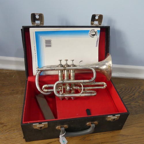 299 - A cased French silver plated soprano Saxophone, with makers mark and mouth piece, together with a 20... 