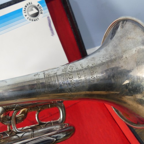 299 - A cased French silver plated soprano Saxophone, with makers mark and mouth piece, together with a 20... 