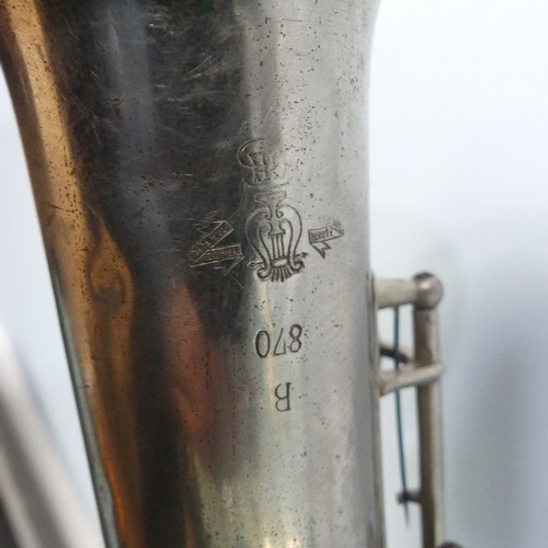 299 - A cased French silver plated soprano Saxophone, with makers mark and mouth piece, together with a 20... 