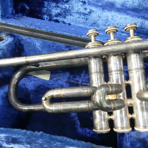 294 - A 'B & M, Champion' silver plated Trumpet, with mouthpiece and stamped 'D123', in fitted hard ca... 