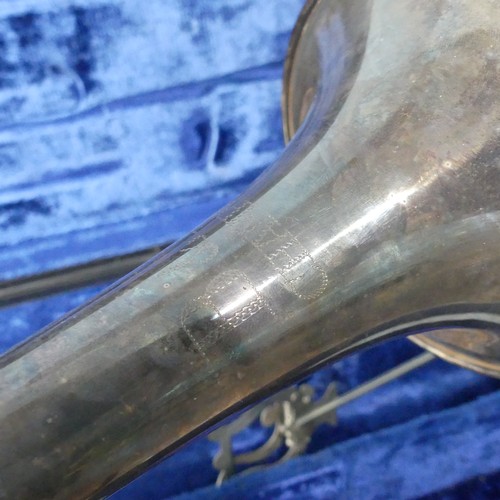 294 - A 'B & M, Champion' silver plated Trumpet, with mouthpiece and stamped 'D123', in fitted hard ca... 