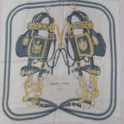 313 - Two Hermès silk twill scarves: Carriage design blue with yellow border, and 'Brides de Gala', grey w... 