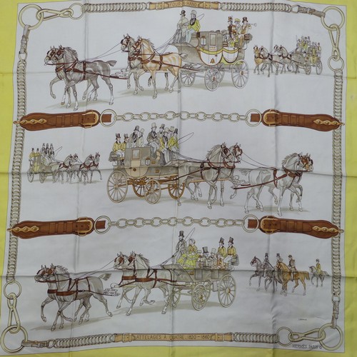 321 - Two Hermès silk twill scarves: 'Four in Hand' or 'Attelages A Quatres', cream ground with yellow bor... 