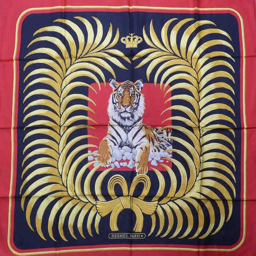 324 - A Hermès silk twill scarf: Royal Tiger design, gold and black on red ground, hand rolled edges, two ... 