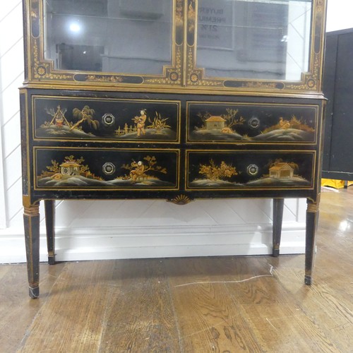 546 - An early 20th century Chinoiserie display Cabinet, black lacquered with gilt painted decorations, tw... 