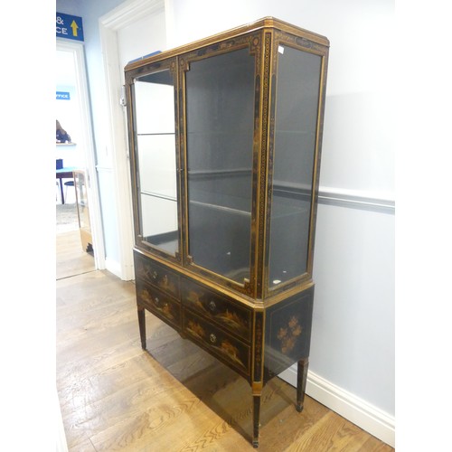 546 - An early 20th century Chinoiserie display Cabinet, black lacquered with gilt painted decorations, tw... 