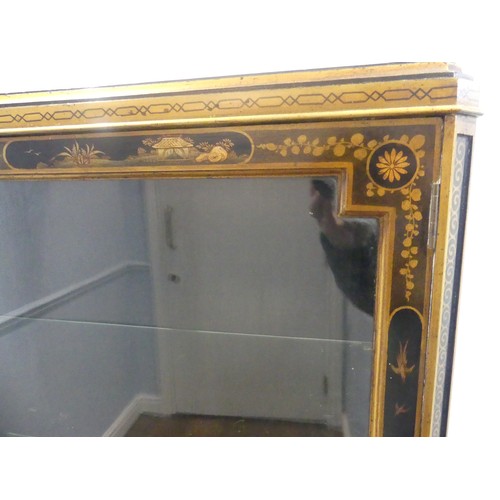 546 - An early 20th century Chinoiserie display Cabinet, black lacquered with gilt painted decorations, tw... 