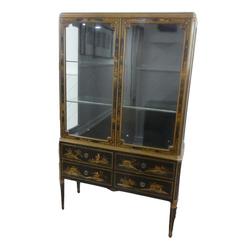 546 - An early 20th century Chinoiserie display Cabinet, black lacquered with gilt painted decorations, tw... 