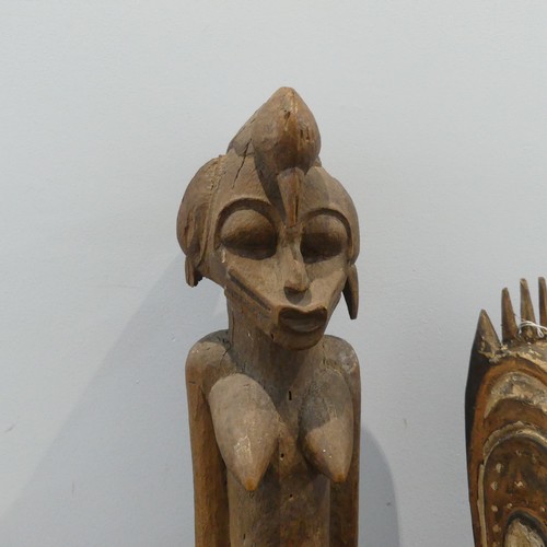 583 - Tribal Artefacts: A Papua New Guineau Sepik Mask, together with a figure similar, and three African ... 