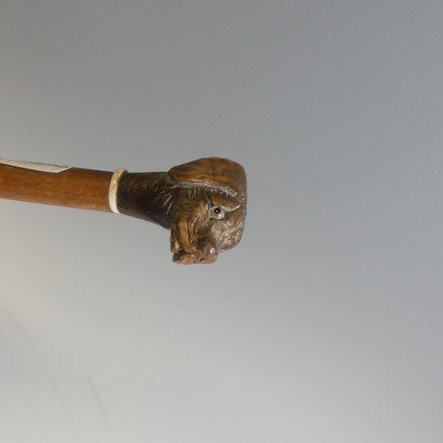 432 - An antique novelty swagger Stick, depicting a spaniel with glass eyes, together with other walking s... 