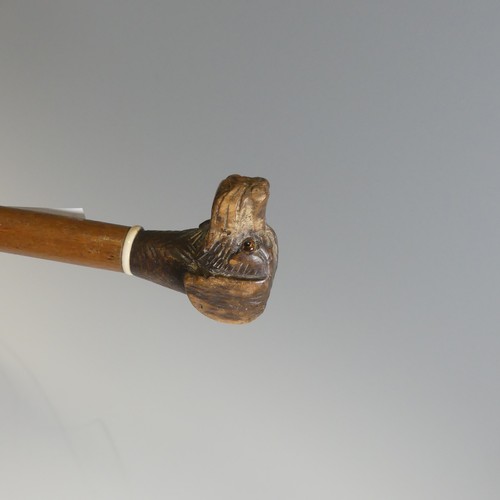 432 - An antique novelty swagger Stick, depicting a spaniel with glass eyes, together with other walking s... 