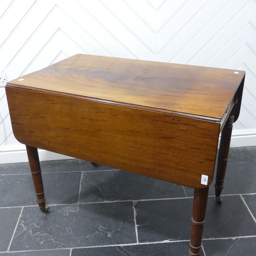 483 - A 19th century mahogany Pembroke Table, with ebony stringing raised on turned supports and brass cas... 