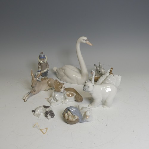 371 - A quantity of nine boxed Lladro Figures, including; Polar Bear No. 1207, Swan No. 5230, Rabbit Eatin... 