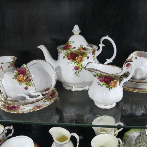 369 - A 19th century Staffordshire part tea set, comprising teapot, sugar basin and cream jug with sixteen... 