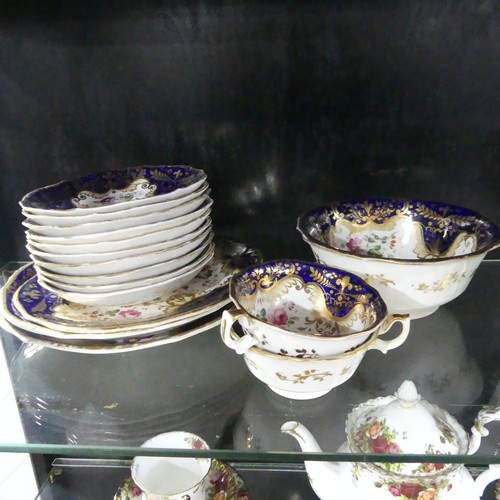 369 - A 19th century Staffordshire part tea set, comprising teapot, sugar basin and cream jug with sixteen... 