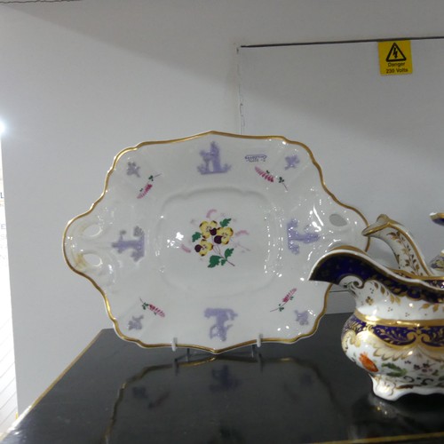 369 - A 19th century Staffordshire part tea set, comprising teapot, sugar basin and cream jug with sixteen... 