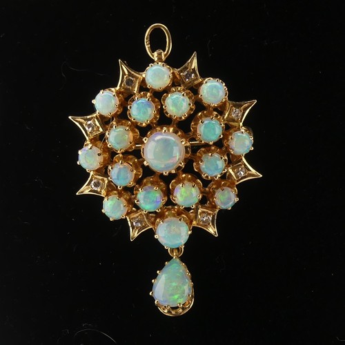 220 - An antique style opal and diamond Pendant / Brooch, the starburst cluster set seventeen circular cab... 