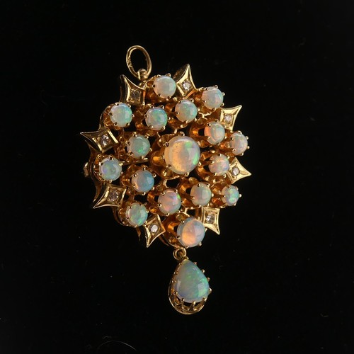 220 - An antique style opal and diamond Pendant / Brooch, the starburst cluster set seventeen circular cab... 