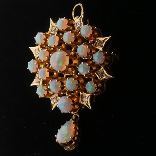 220 - An antique style opal and diamond Pendant / Brooch, the starburst cluster set seventeen circular cab... 