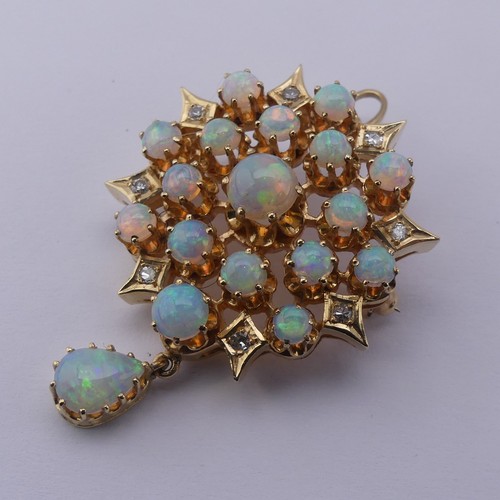 220 - An antique style opal and diamond Pendant / Brooch, the starburst cluster set seventeen circular cab... 