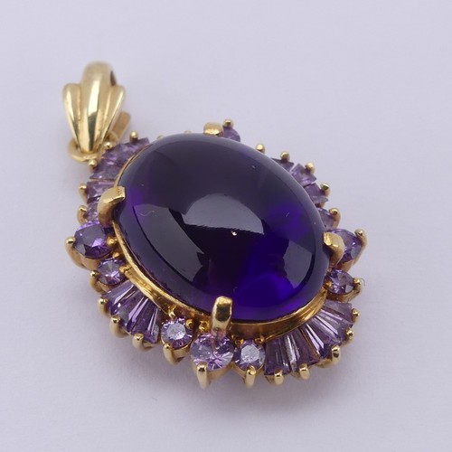 221 - A cabochon amethyst Pendant, the oval central amethyst approx. 17.5mm long, above a surround of pale... 