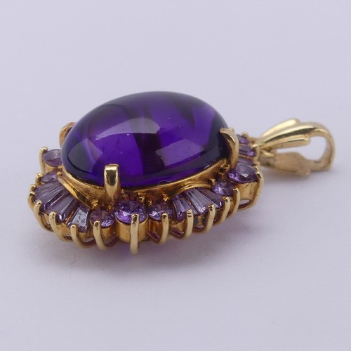 221 - A cabochon amethyst Pendant, the oval central amethyst approx. 17.5mm long, above a surround of pale... 