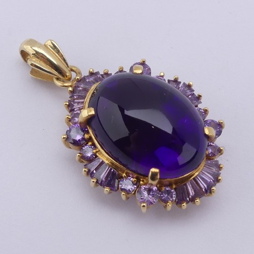 221 - A cabochon amethyst Pendant, the oval central amethyst approx. 17.5mm long, above a surround of pale... 