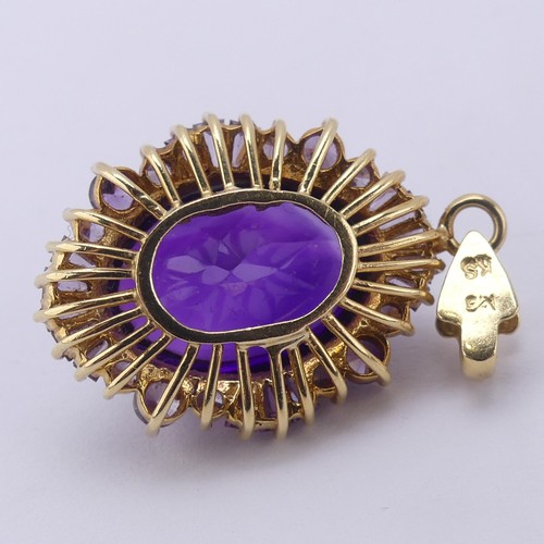 221 - A cabochon amethyst Pendant, the oval central amethyst approx. 17.5mm long, above a surround of pale... 