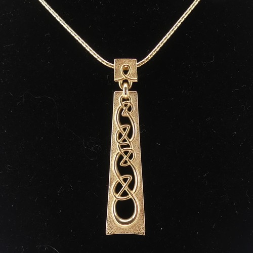 223 - Ola Gorie; a Scottish 9ct yellow gold Pendant, the plaque pierced with Celtic design, 4.5cm long, on... 