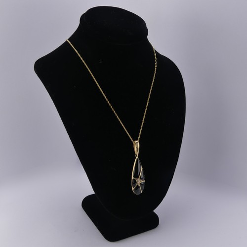 224 - A 14ct yellow gold, onyx and diamond Pendant, by Kabana, the pear shaped drop with five panels of bl... 